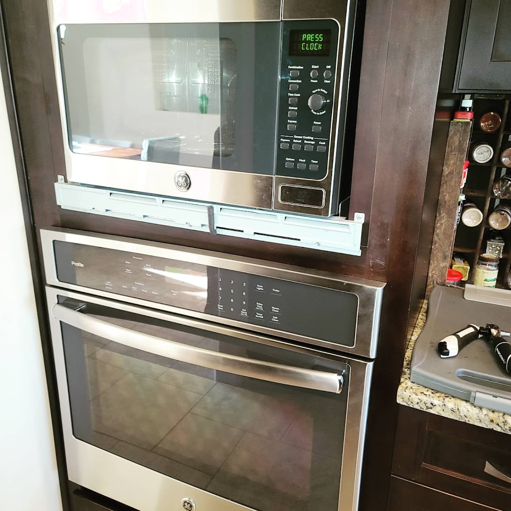 Professional installation team working in Satellite Beach kitchen